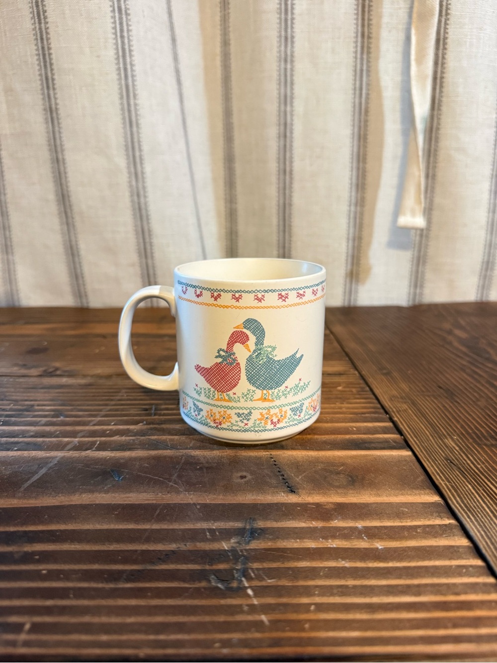 Russ Cream Ceramic Mug with Red and Teal Duck Design